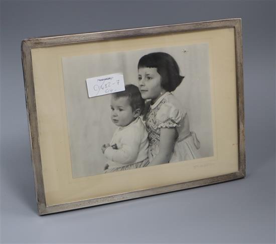 A 1950s engine turned silver mounted photograph frame, Sanders & MacKenzie, Birmingham, 30.9cm.